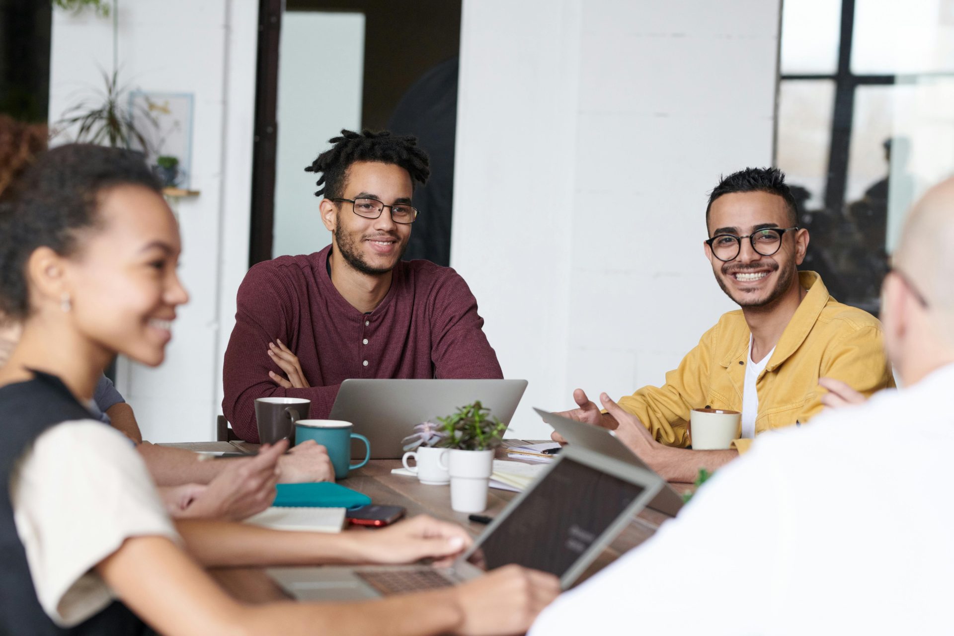 A group of professionals collaborating in a modern office setting.